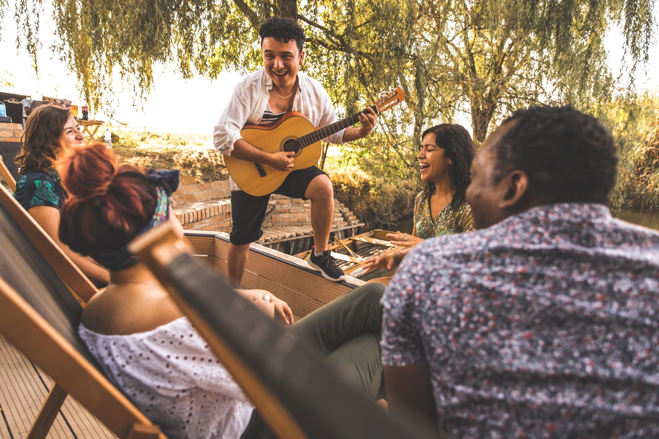 Friends gathered together sharing music and laughter