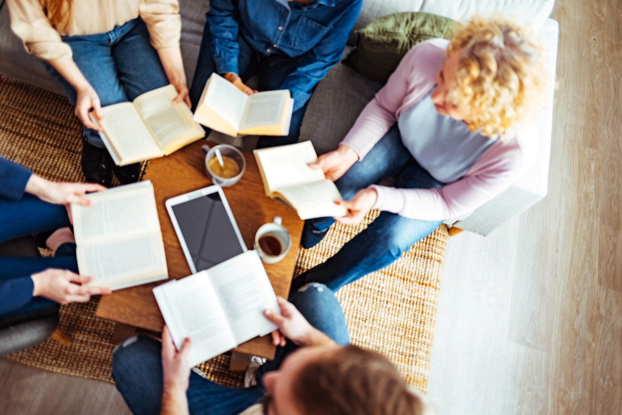 Small group in conversation during a book club style gathering
