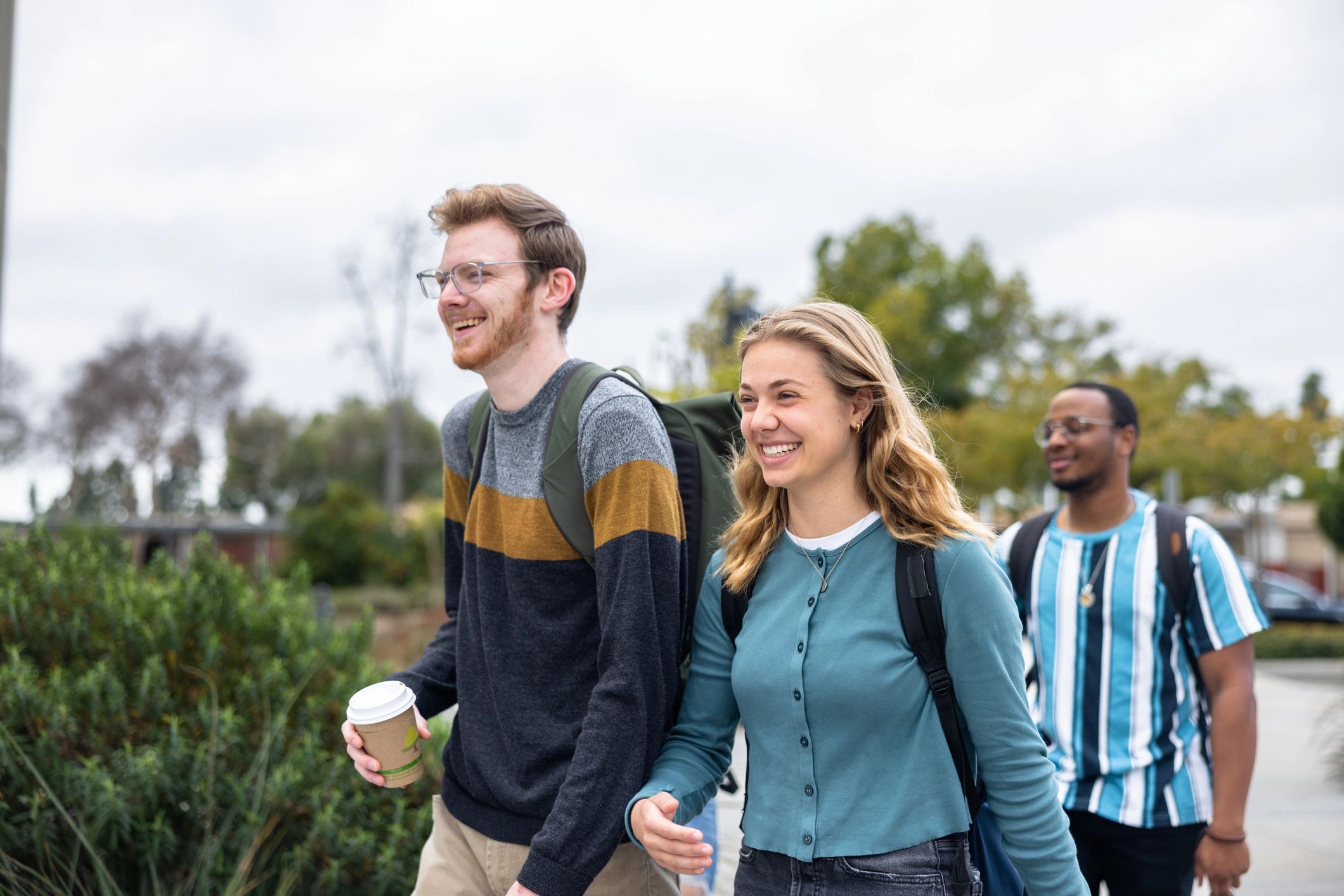 People walking together outdoors in conversation