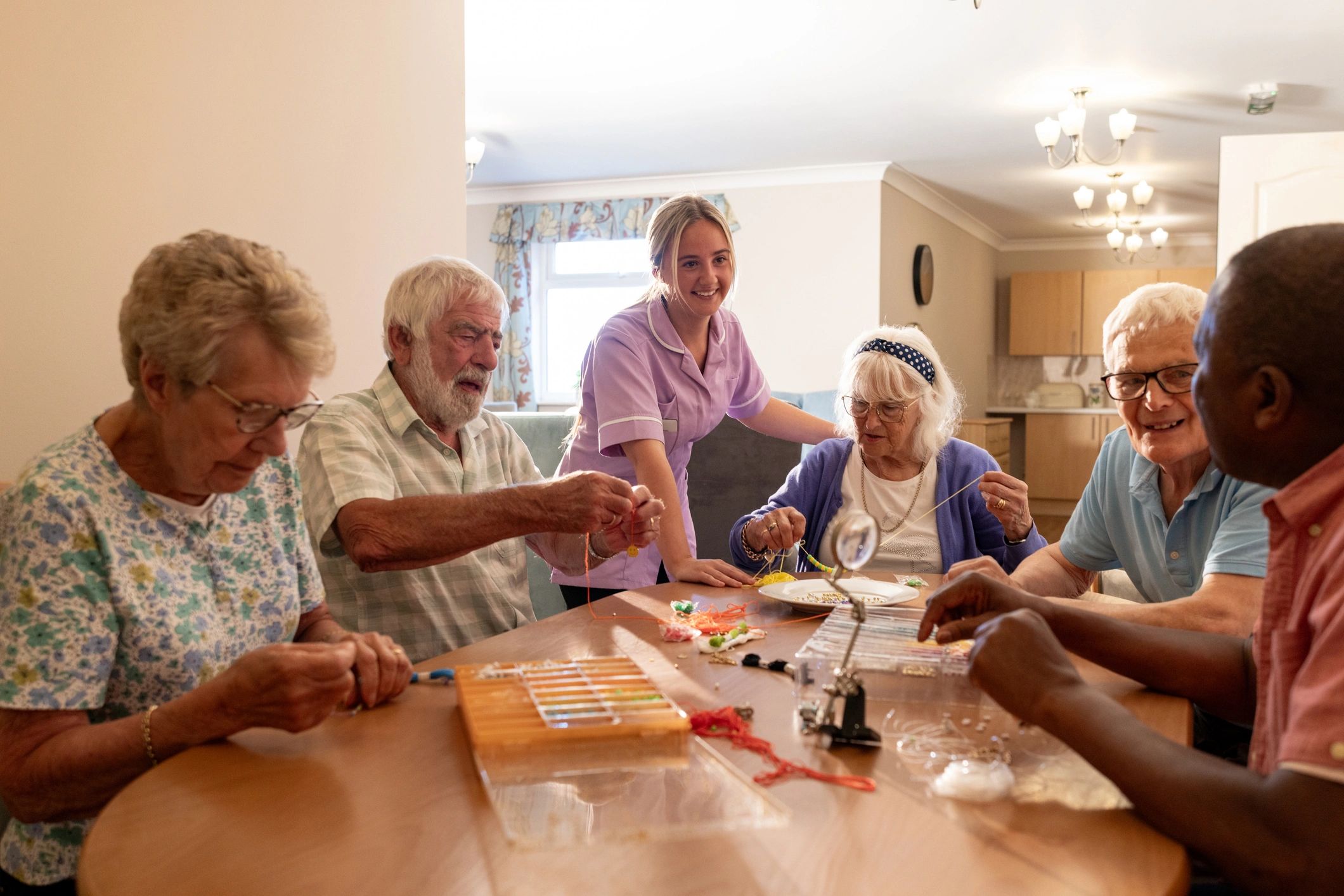 People gathered together in a warm, supportive community setting