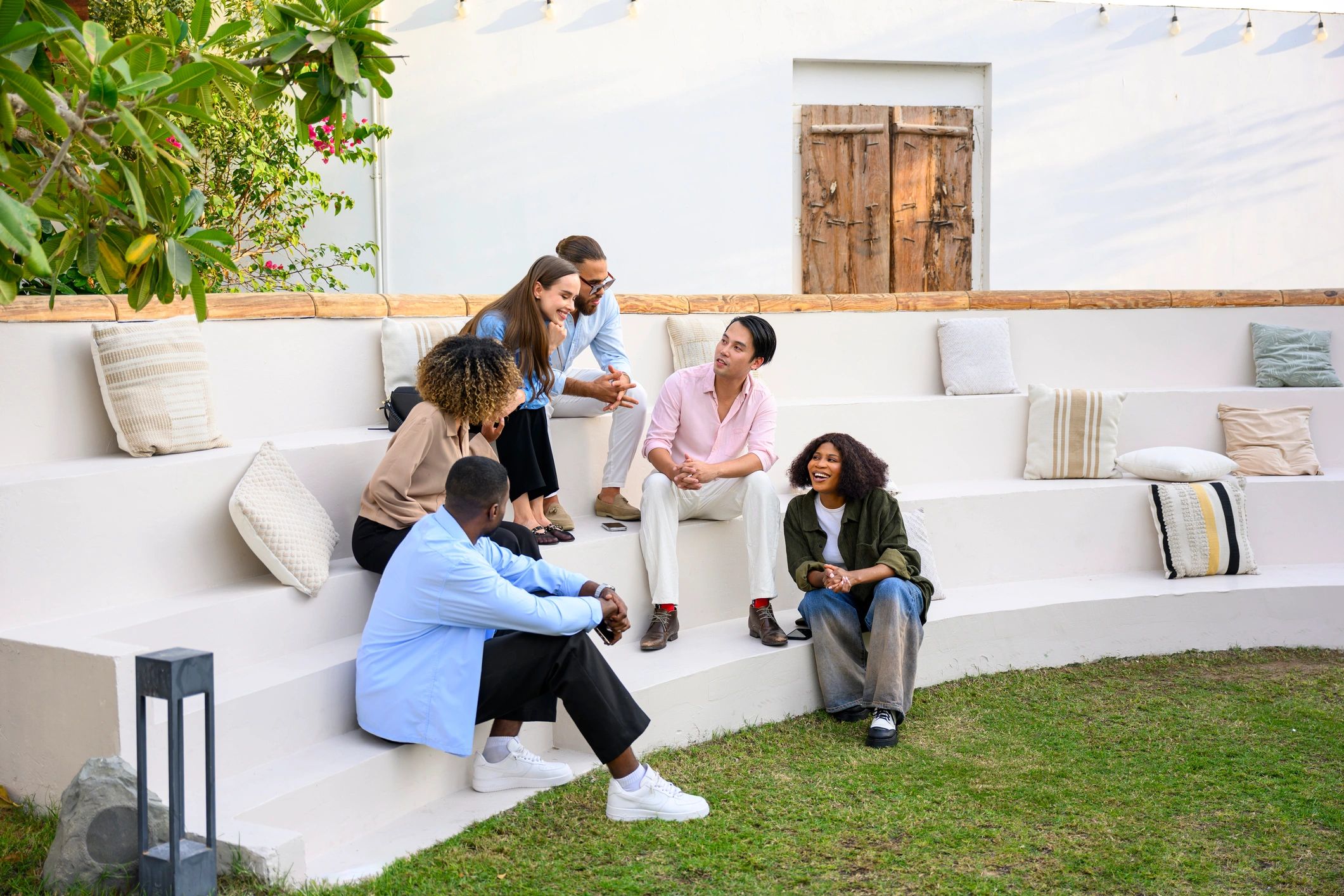 Friends gathered outdoors in conversation and community