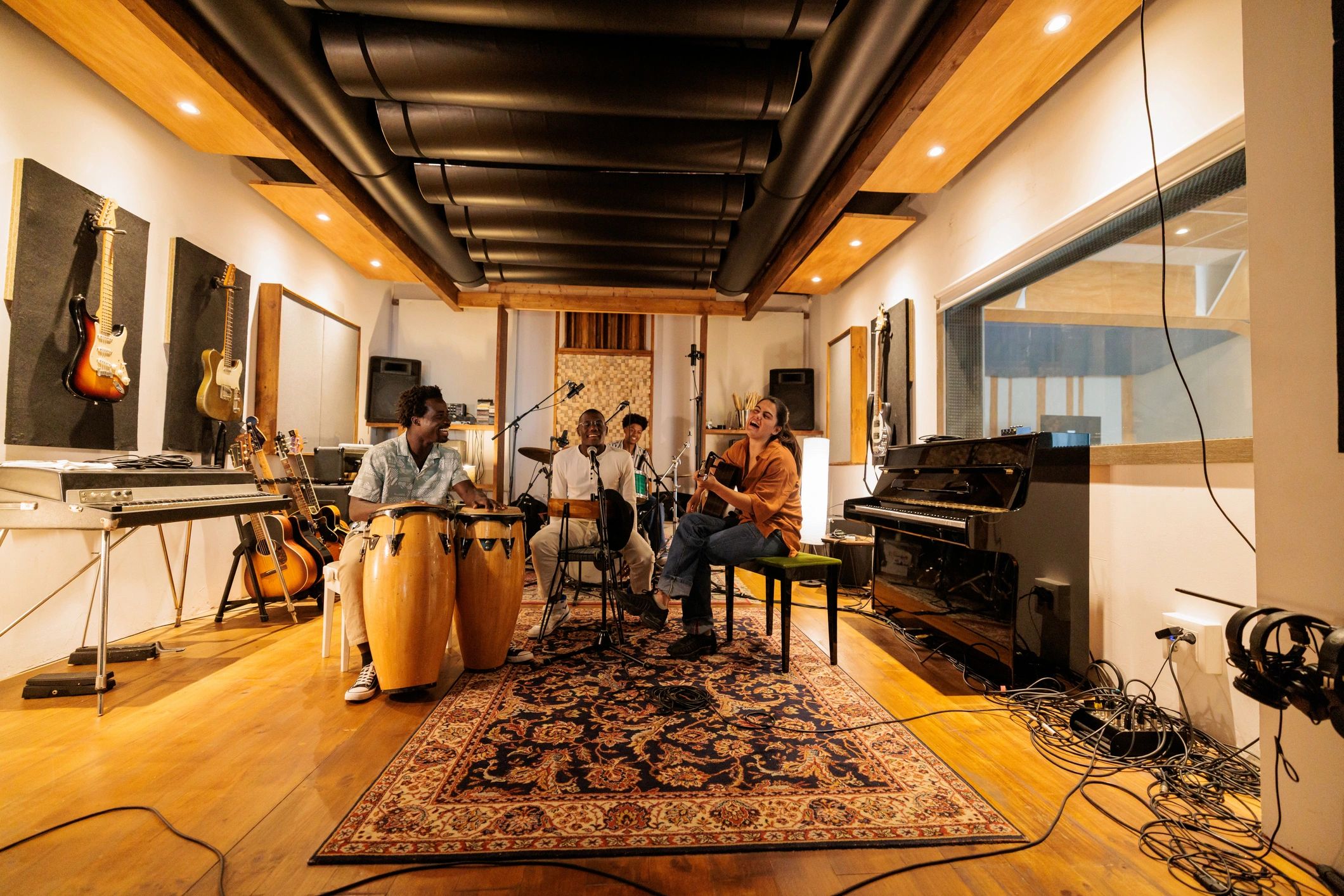 Musicians rehearsing together in a creative studio