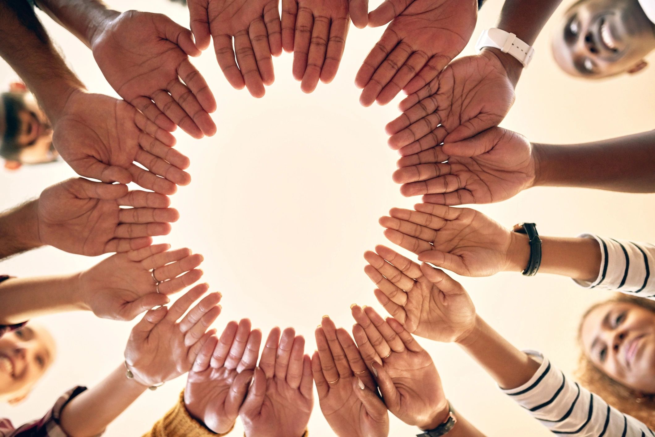 Group of people joining their hands together